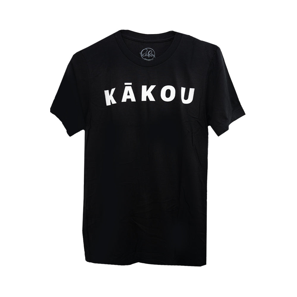 A black t-shirt displayed against a white background, featuring the word "KĀKOU" in bold, white capital letters centered on the chest.