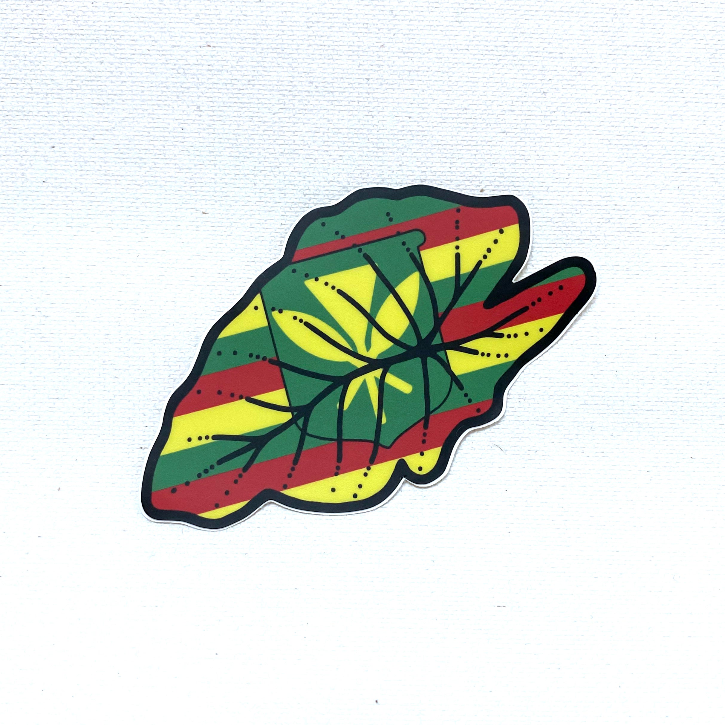 A sticker with the kanaka maoli flag in the outline of a kalo leaf, emphasizing a connection to the nature of Hawai'i
