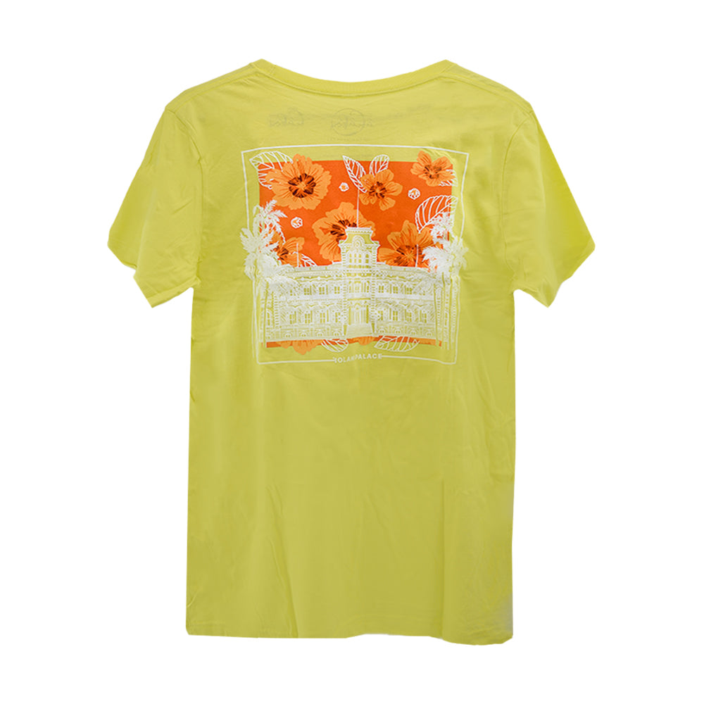 A yellow t-shirt adorned with a design of a building and blooming flowers.