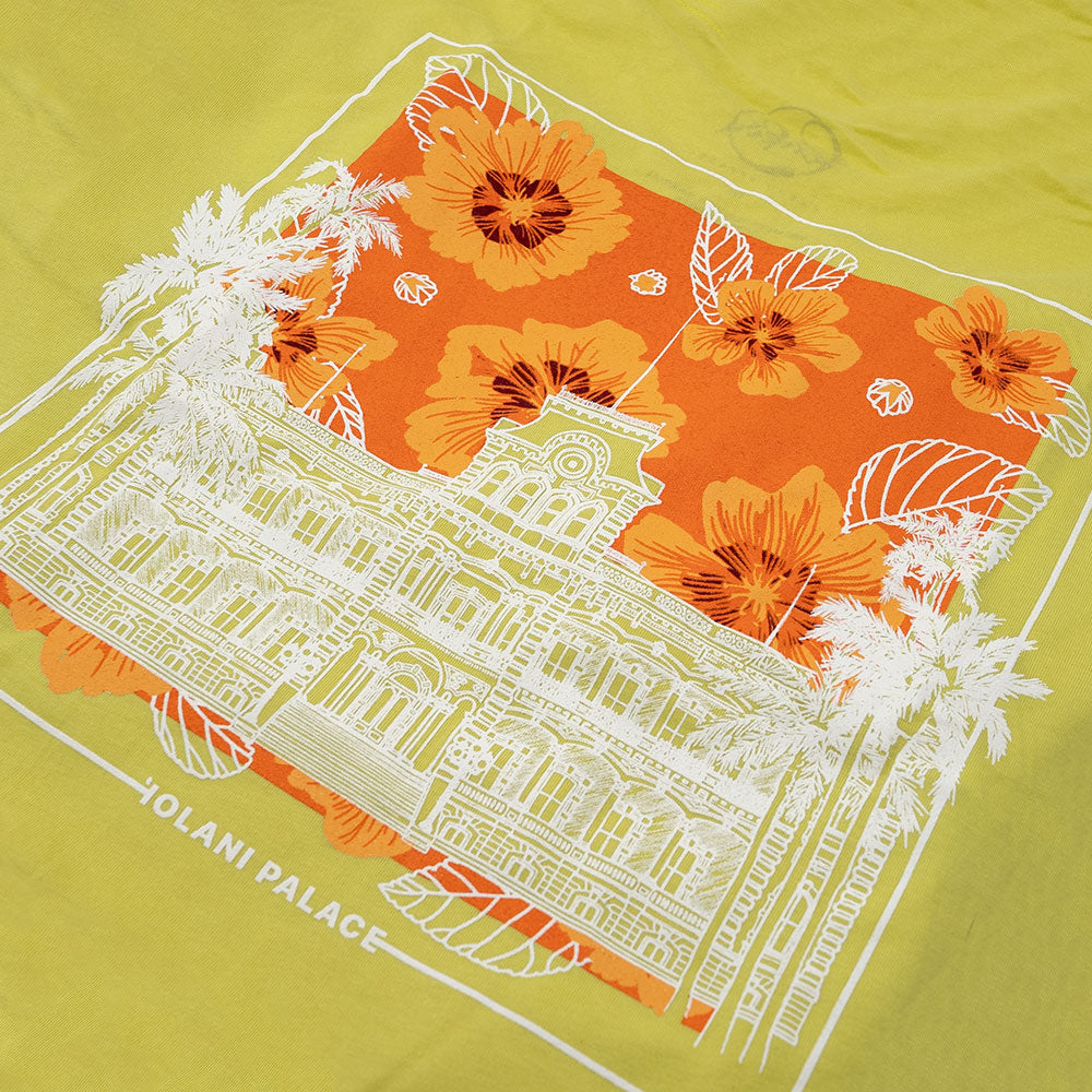 A yellow t-shirt featuring a vibrant white and orange design on the fron