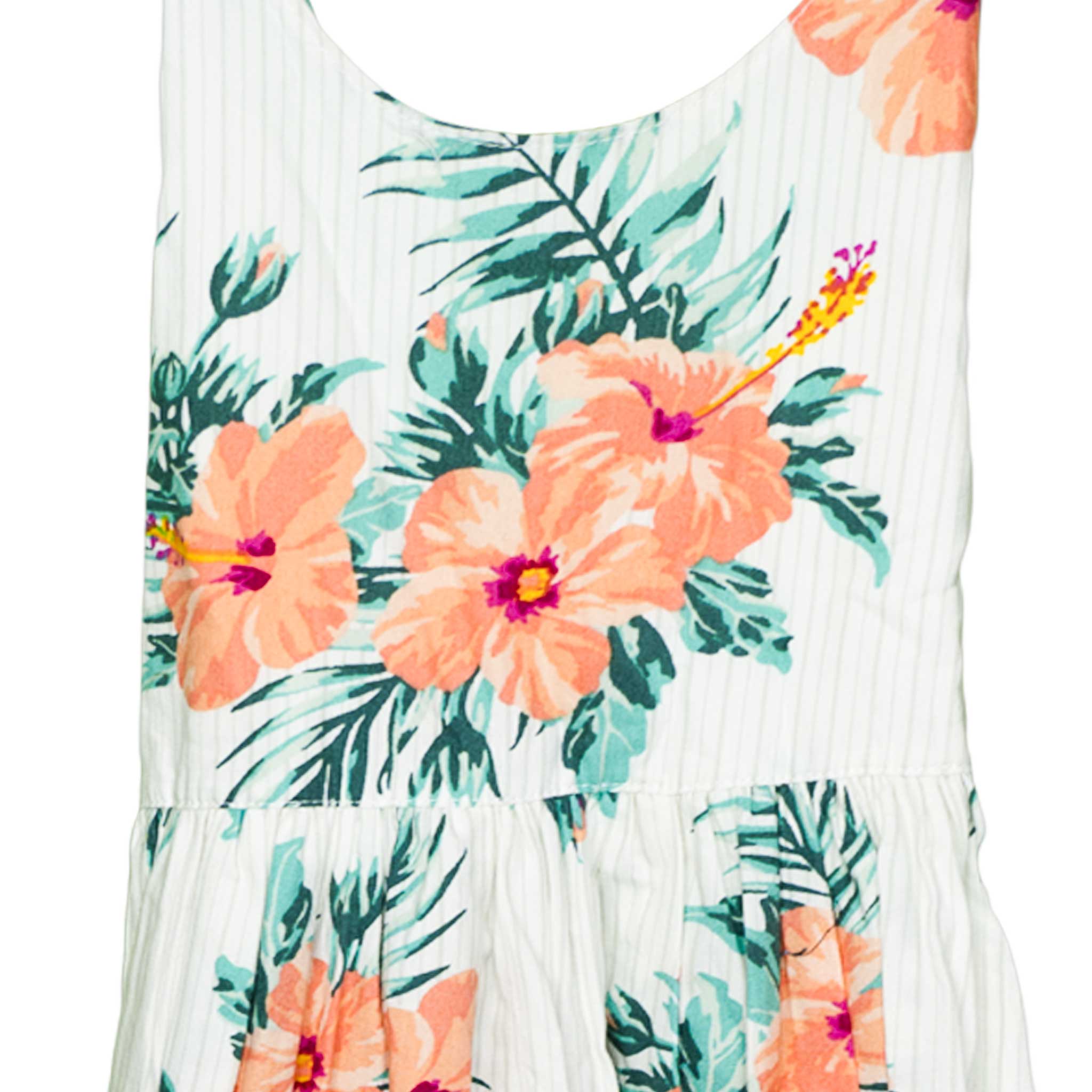 Vibrant floral-print sundress for girls featuring bold hibiscus blooms and lush green leaves on a soft, striped background, made to brighten any summer outing.