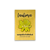 Floral pin on a cardboard backing with 'laulima' branding