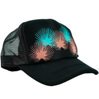 A black trucker hat with a mesh backing and a pattern of coral and teal colors on the front.